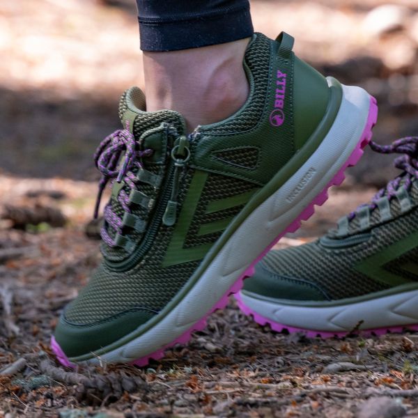 women's expresso mid tops in foreground with ocean in background